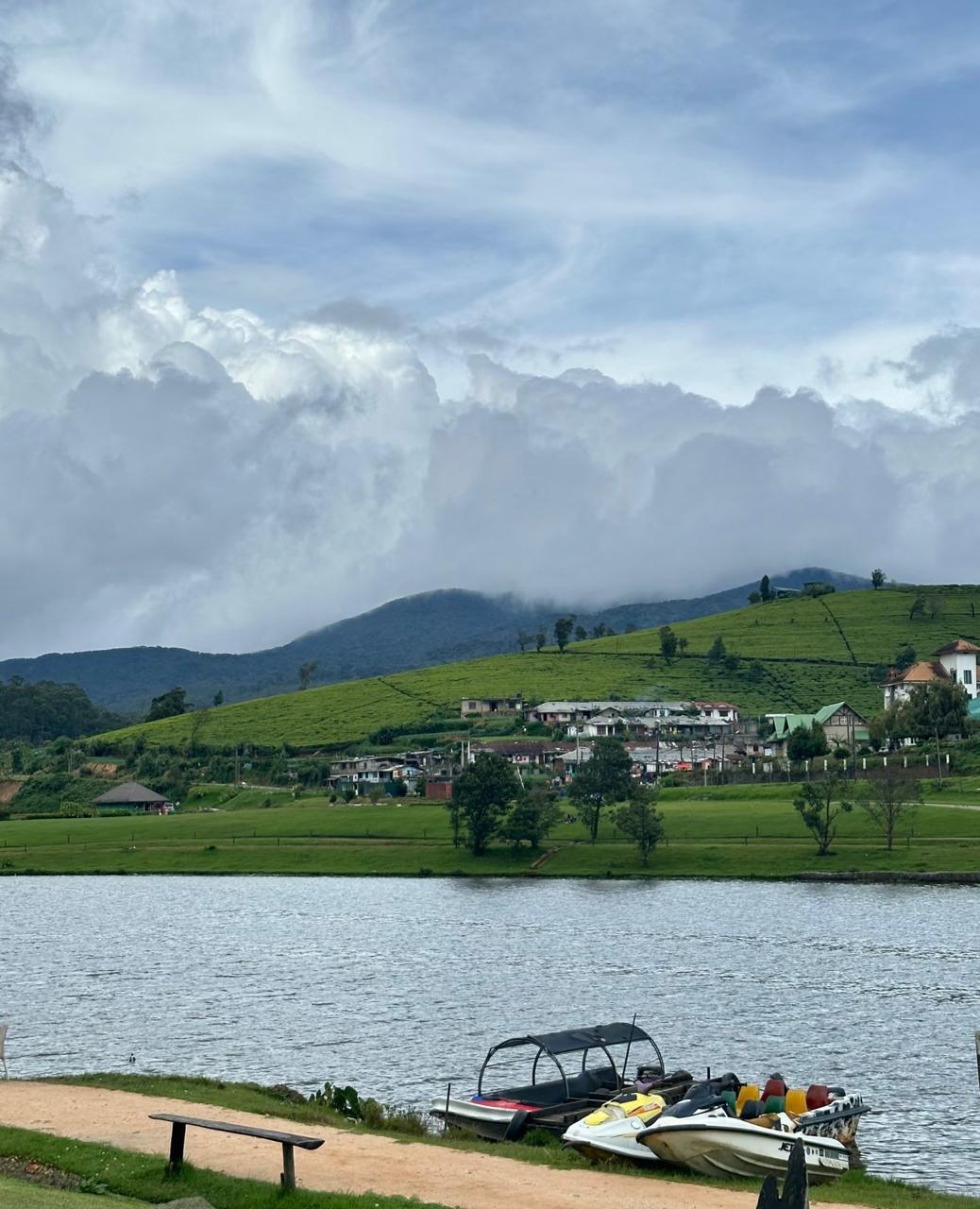 Gregory Lake Nuwara Eliya with boats and mountain reflection