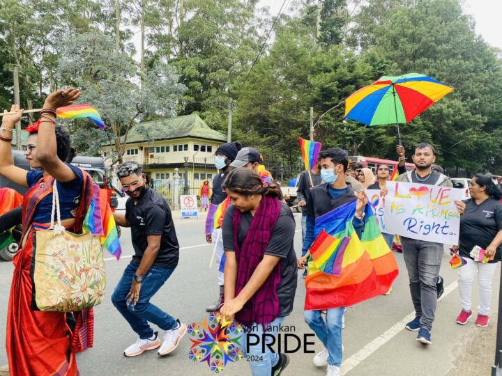 Diverse group of Sri Lankans including LGBTQ+ community members working together on community project