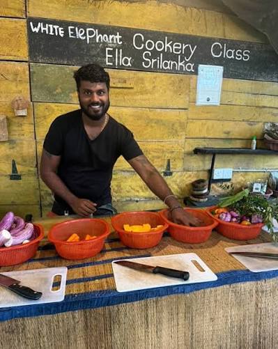 LGBTQ+ travelers learning traditional Sri Lankan cooking with local family - authentic cultural experience