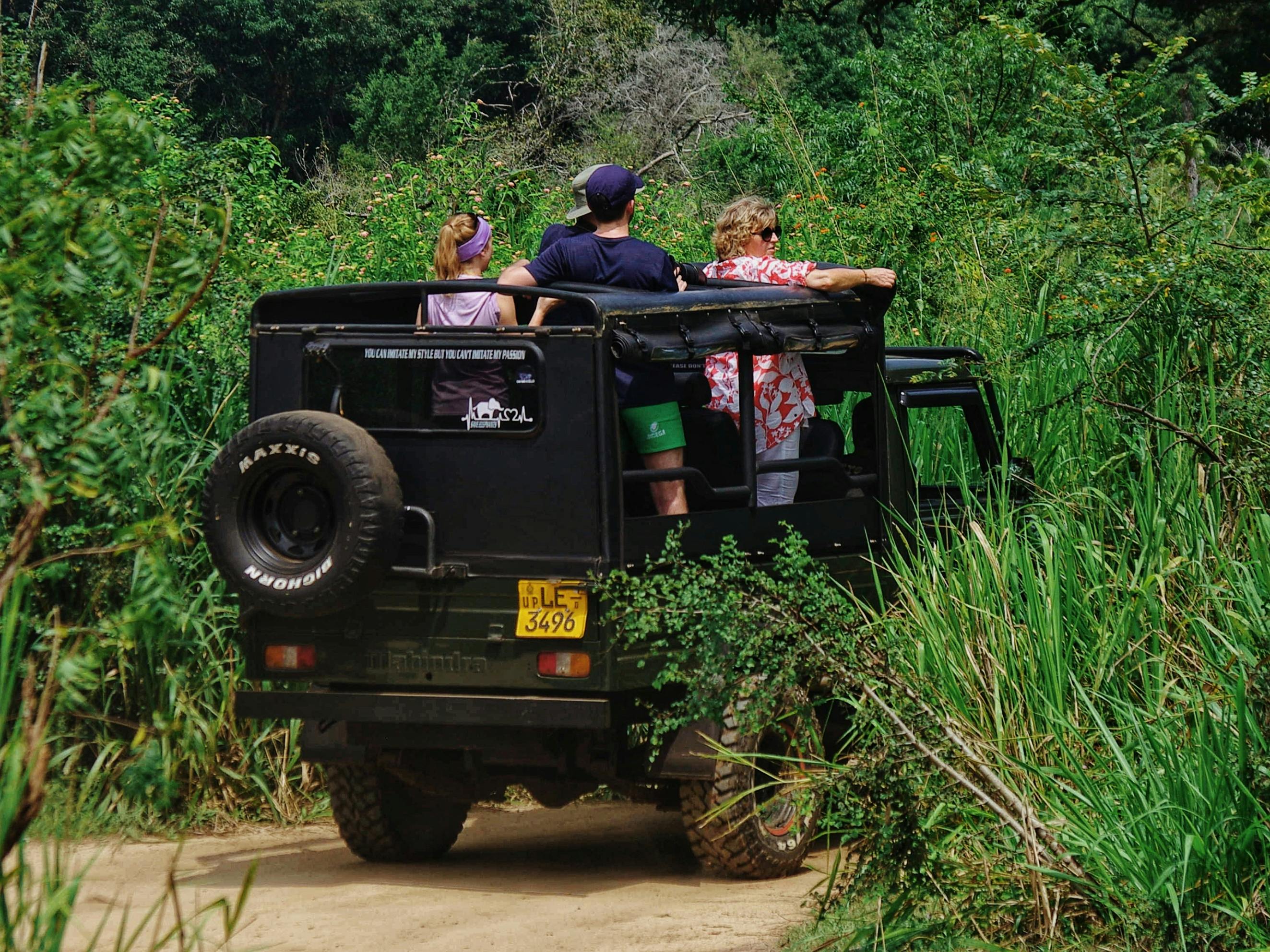 Couple on jeep safari spotting leopard in Yala